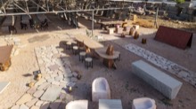 Display yard with stone furniture and patio paving from above