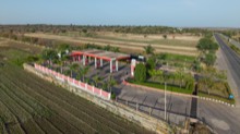 Aerial view of the roadside complex with fields beyond