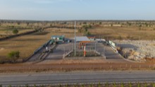 Roadside service station and stone stock area from above